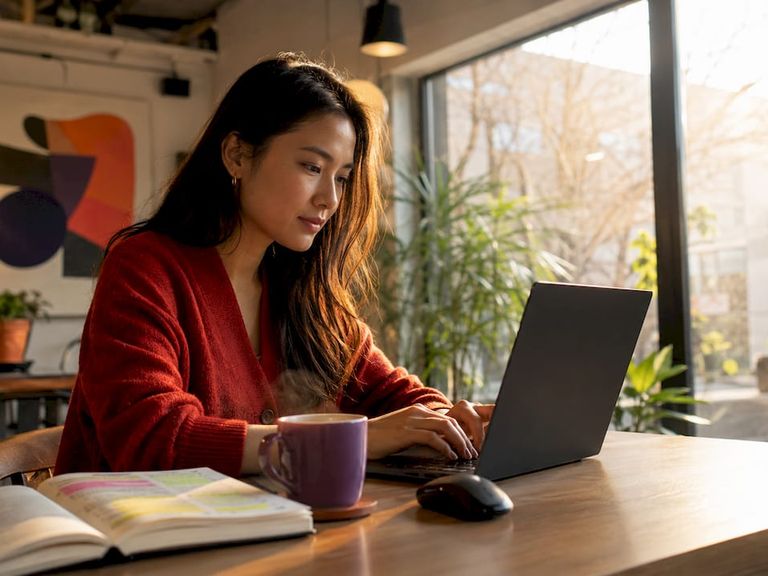 Woman optimizing SEO tags at home desk