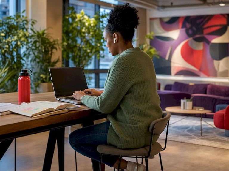 Engineer coding integrations at standing desk