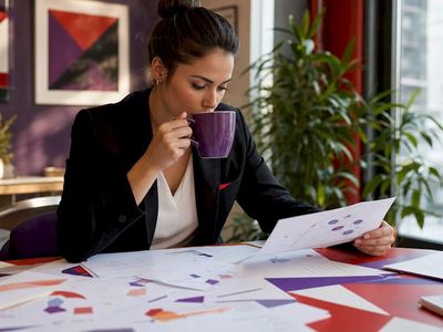 Woman working on content discoverability at desk